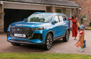 Close-up of a Chery electric vehicle connected to a charging station